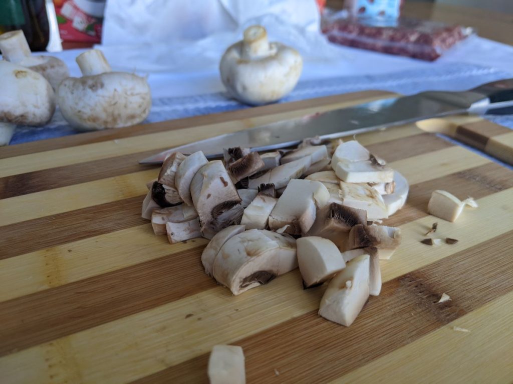chopped mushrooms on a cutting board