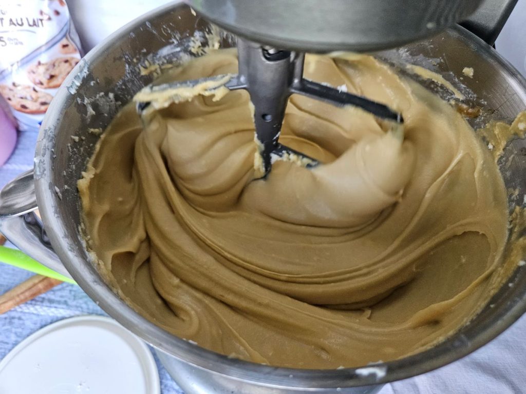 ingredients for chocolate cream cheese cookies being creamed together in a kitchen aid stand mixer