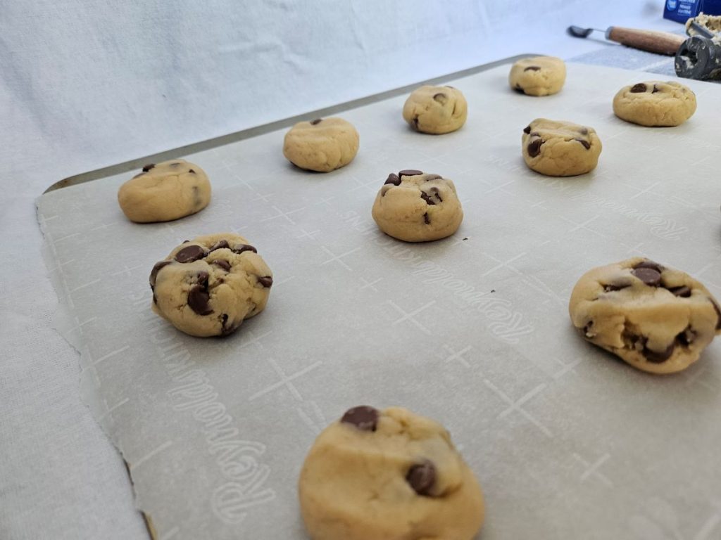 raw chocolate cream cheese cookies on a baking tray