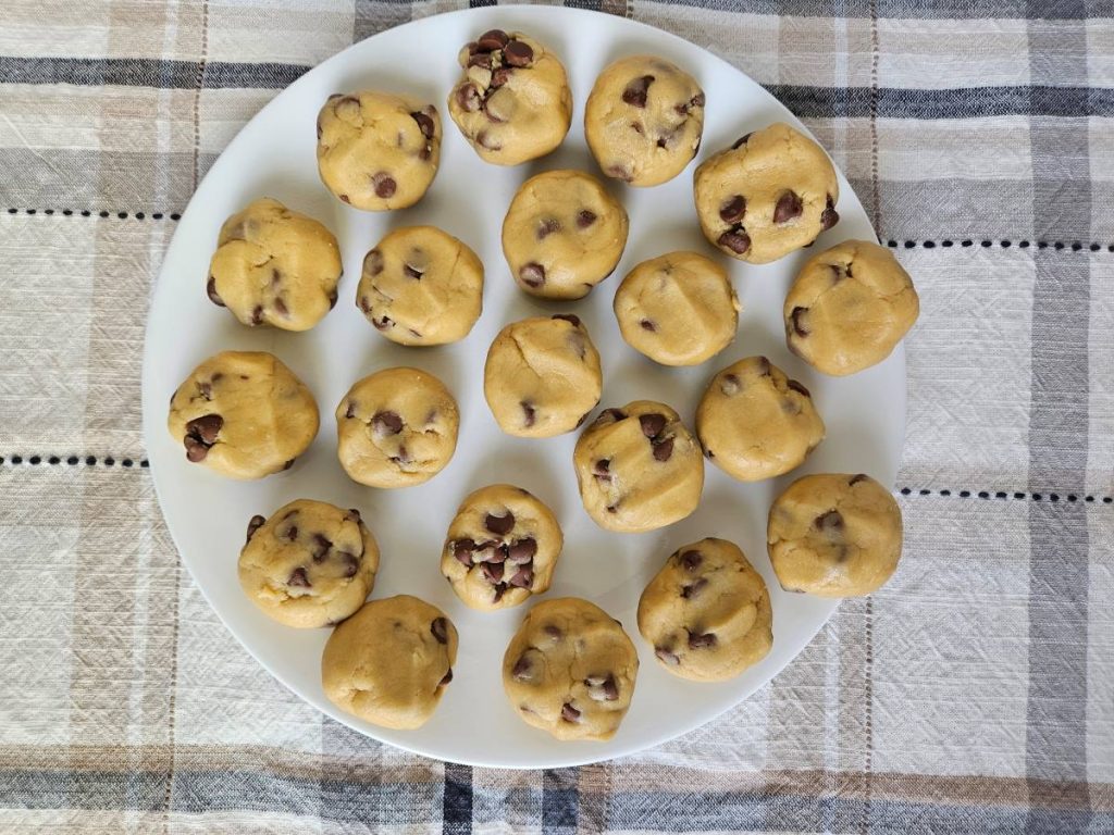 raw chocolate chip cream cheese cookies on a white plate 