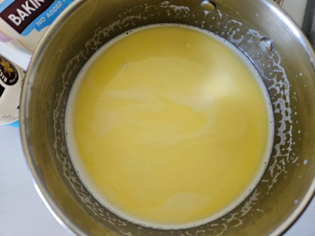 Milk with melted butter in a saucepan